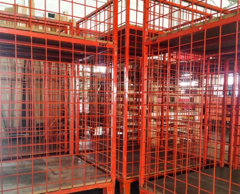 Cage security and roller lines in cargo warehouse and ready loading shipment to container truck for transportation to destination in logistics industry_