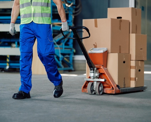 worker using pallet jack