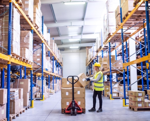 worker loading boxes in warehouse