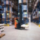 Industrial building large warehouse interior with forklift and palette